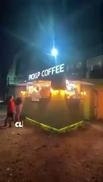 A Pickup Coffee stand lit up at night, one of the merchants Novaluxia points vouchers redeem at