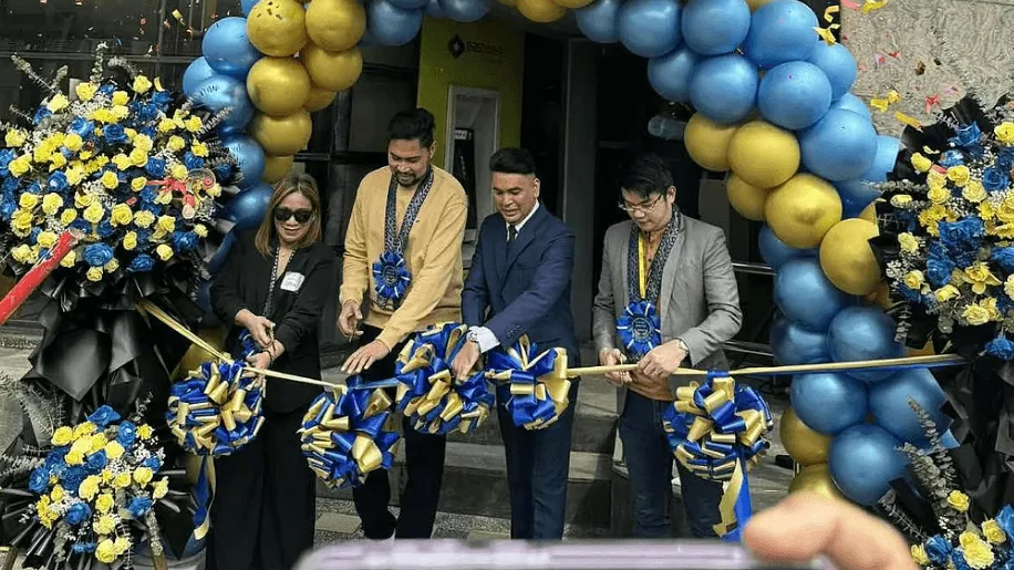 Four people cutting a ribbon at a Novaluxia store opening, part of the record behind our novaluxia reviews